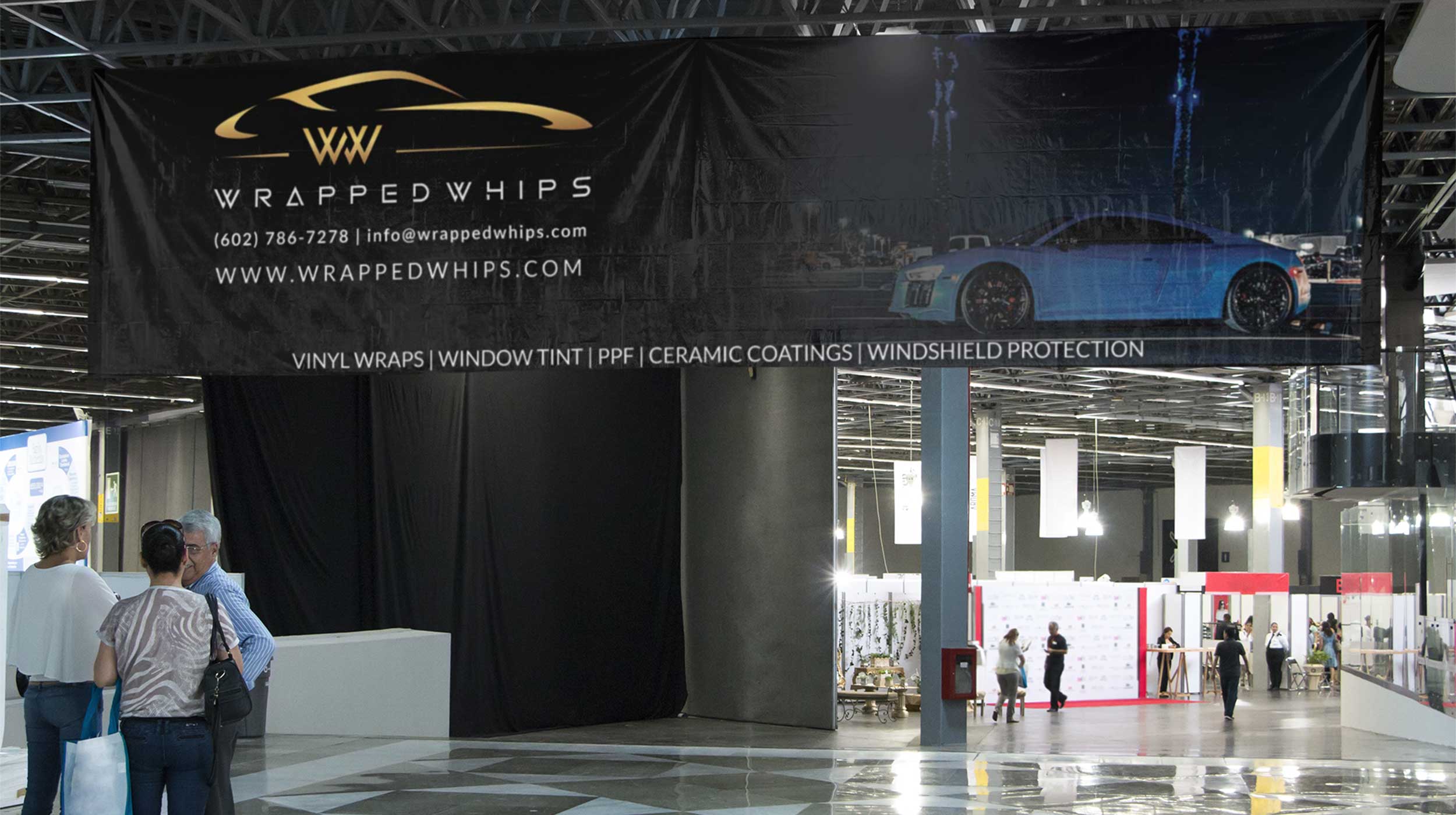 A large banner hanging inside a convention center